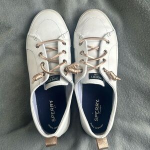 White Sperry sneakers